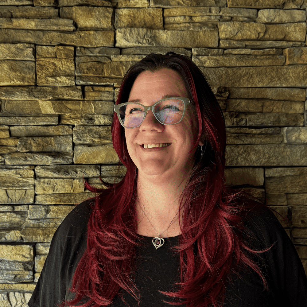 Portrait of Chrissie Galatro, a professional stylist at Enmoda Salon x Spa, showcasing their expertise and style.