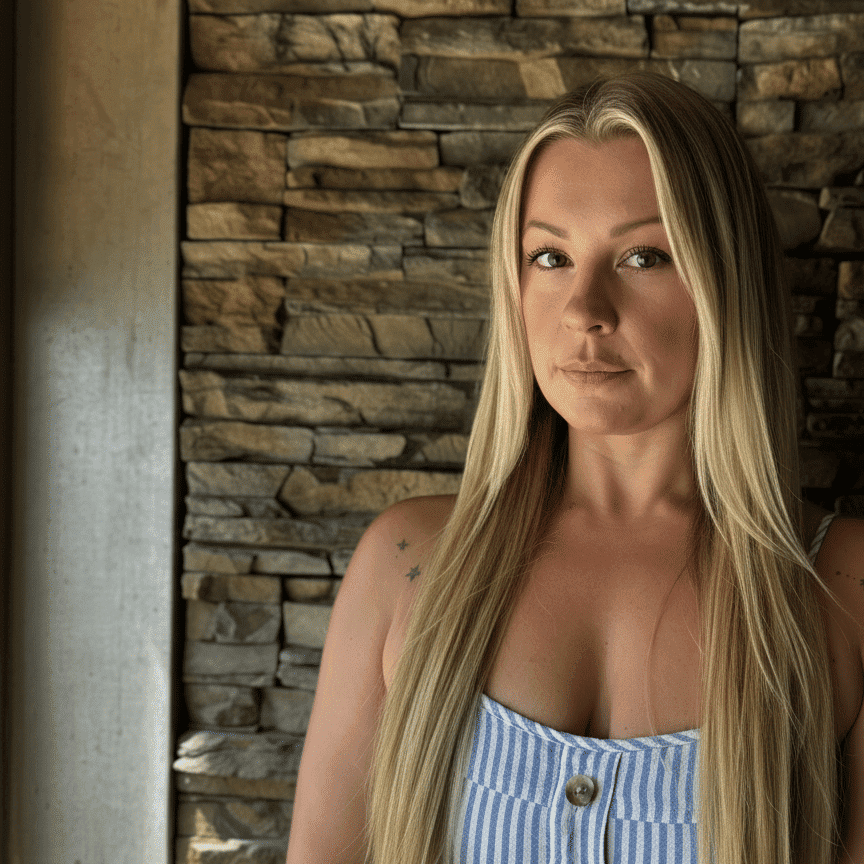 Portrait of Gina Popova, a professional stylist at Enmoda Salon x Spa, showcasing their expertise and style.