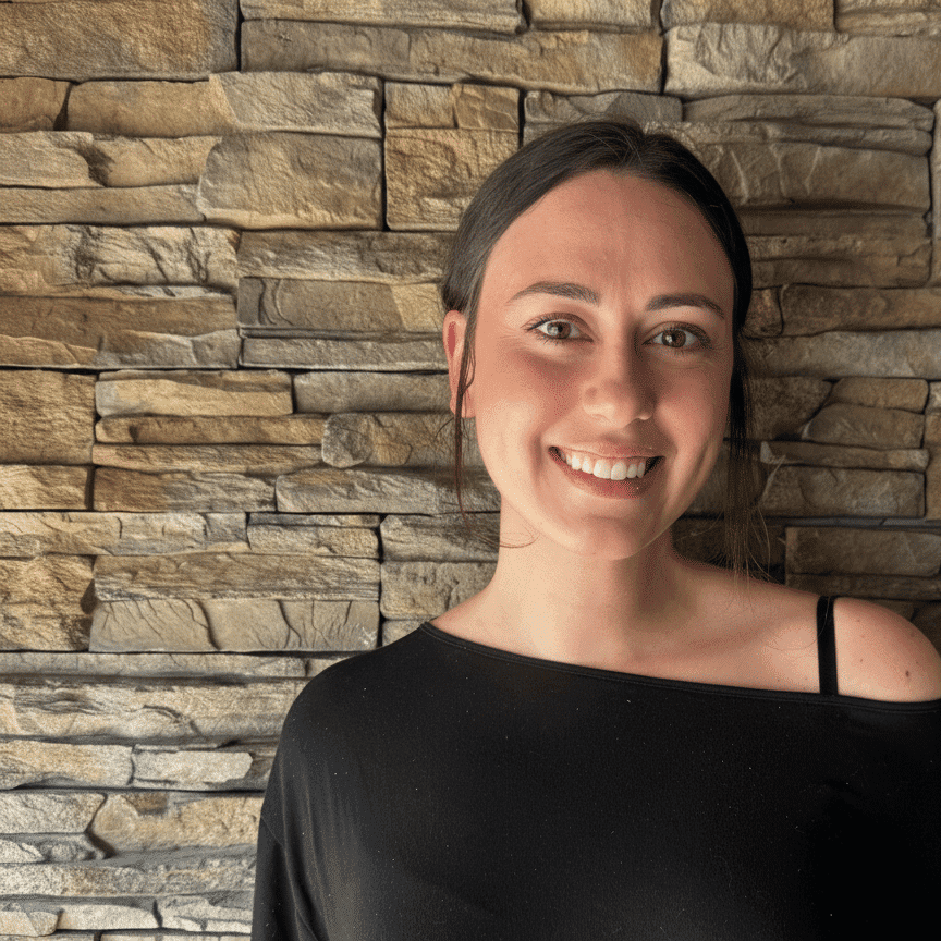 Portrait of Cassandra Holeman, a professional stylist at Enmoda Salon x Spa, showcasing their expertise and style.